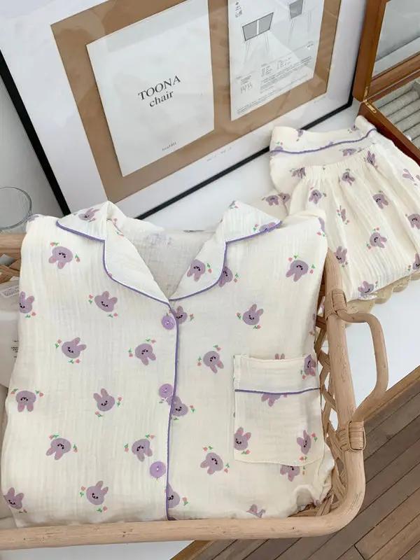 Folded bunny print cotton gauze pajamas in basket