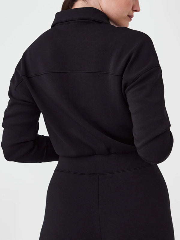 Back view of black long sleeve jumpsuit
