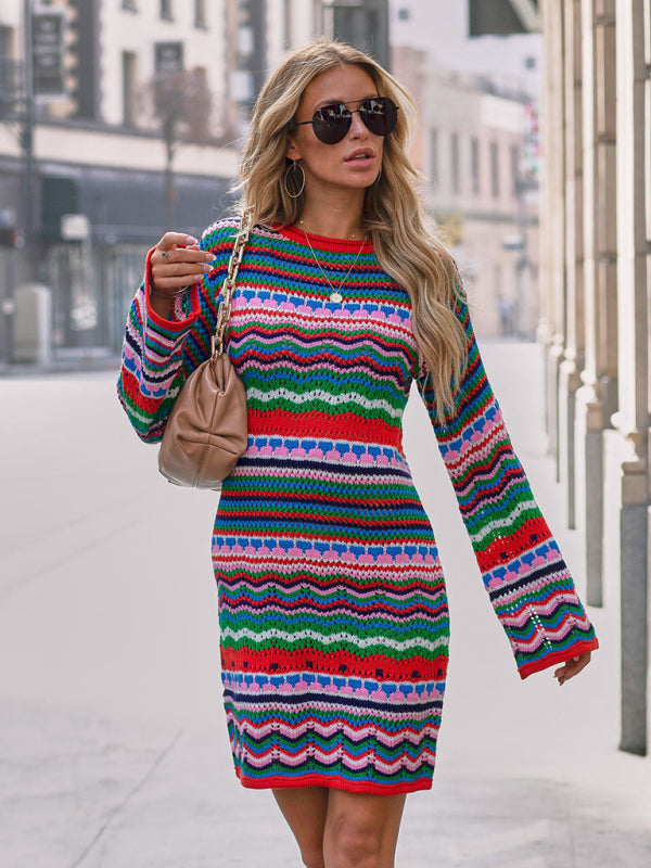 Woman in colorful striped dress on city street
