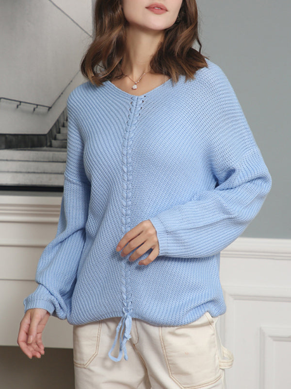 Light blue V-neck drawstring pullover sweater worn casually