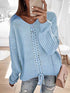 Light blue V-neck drawstring pullover sweater, styled with jeans