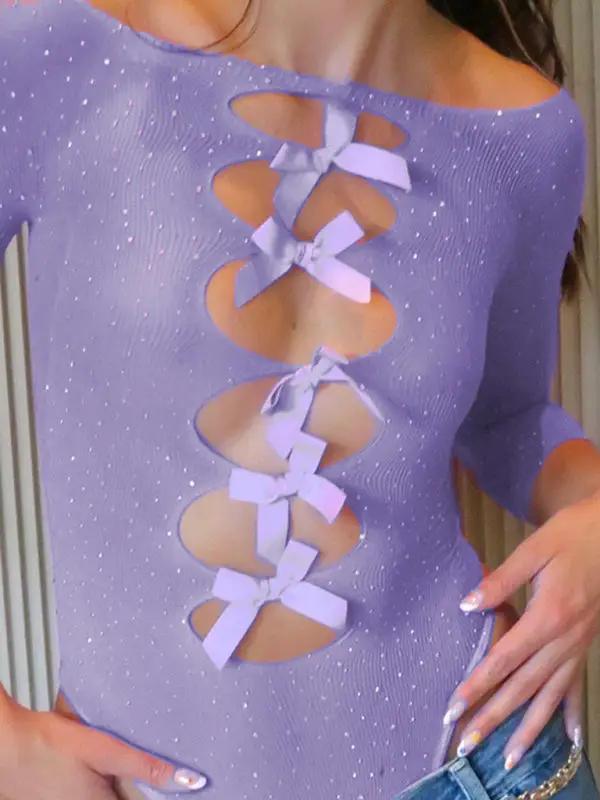 Close-up of purple see-through jumpsuit with bows