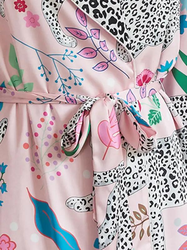 Detail of lace-up belt on animal print bathrobe