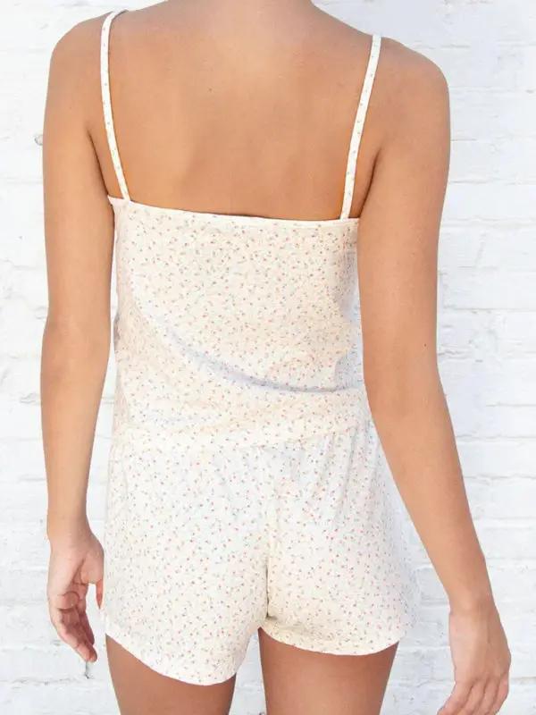 Back view of floral suspender shorts suit