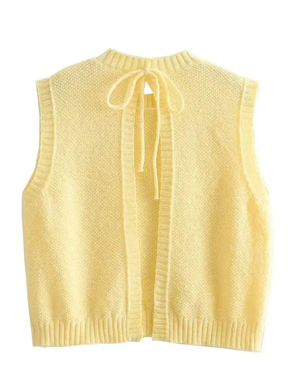 Back view of yellow knitted vest top with lace-up design