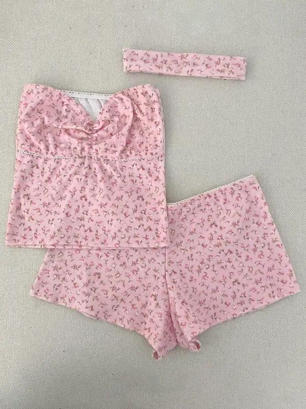 Flat lay of pink printed tube top and shorts set