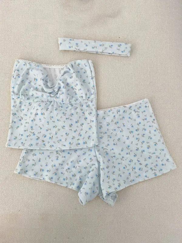 Flat lay of blue printed tube top and shorts set