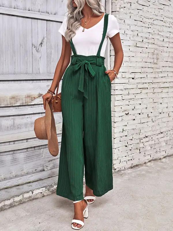 Solid color green overalls featuring wide legs and adjustable straps