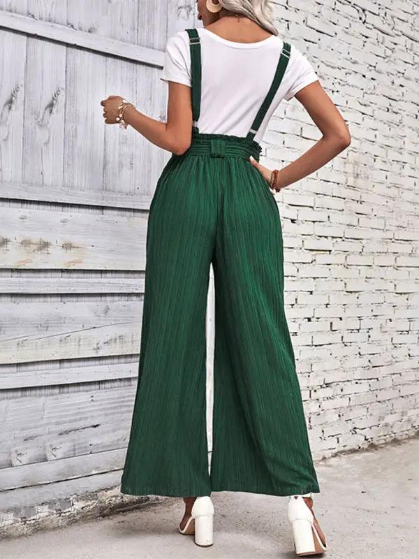 Back view of green wide leg overalls with adjustable straps
