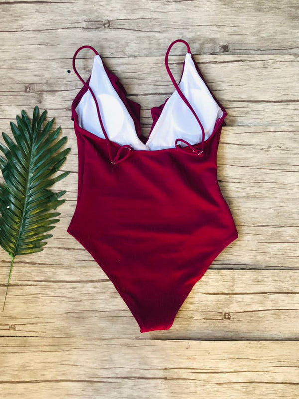 Back view of red ruffled one-piece swimsuit