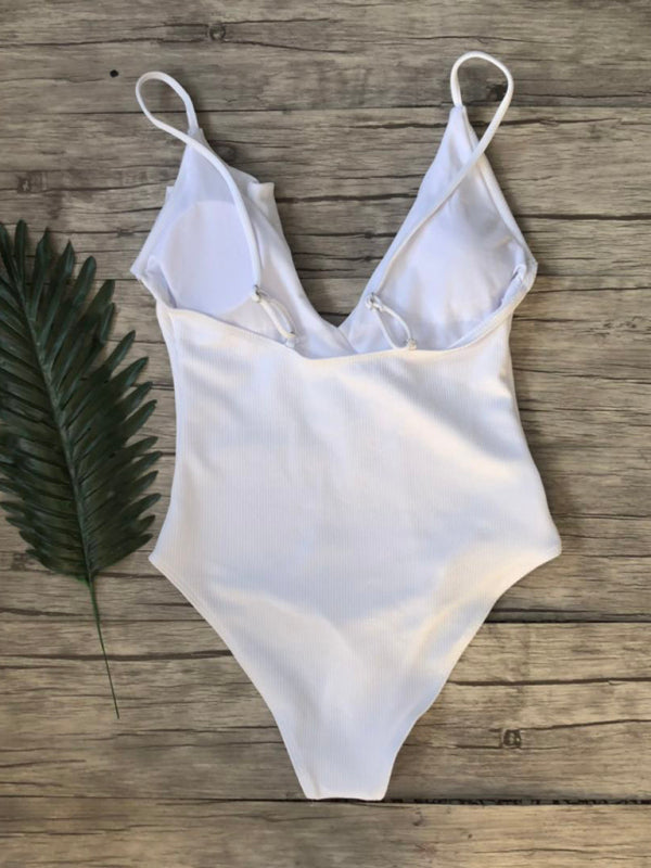 Back view of white ruffled one-piece swimsuit