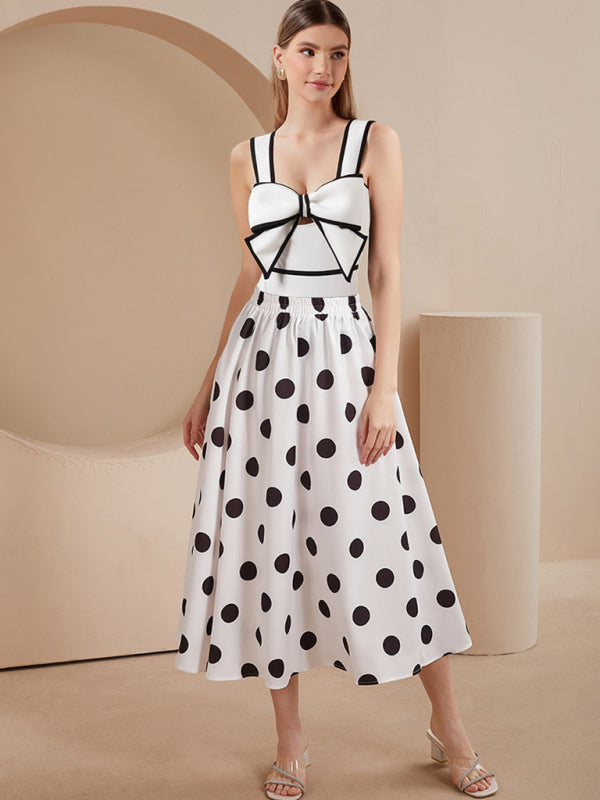 Model wearing swimsuit and polka dot skirt indoors