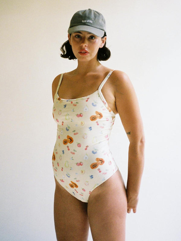 Woman in colorful printed backless sports swimsuit