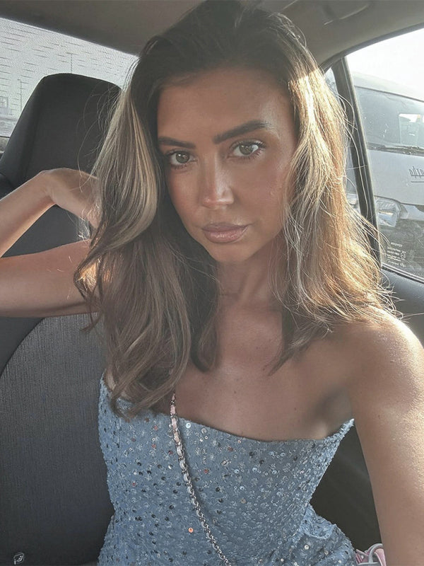 Close-up of woman in denim sequined tube top