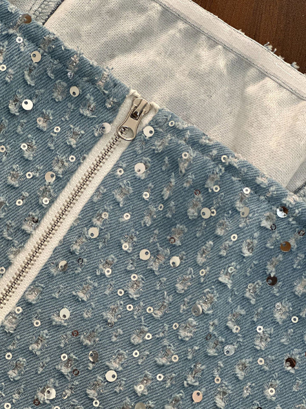 Close-up of denim sequined fabric with zipper
