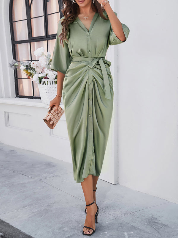 Chic green dress featuring button and tie accents