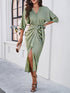 Elegant green waist-cinching dress with button detail