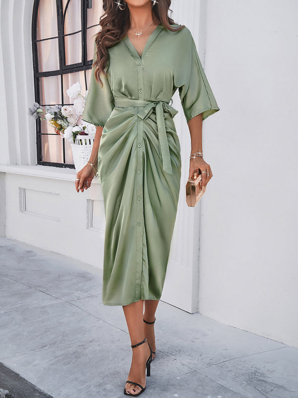 Stylish green dress with waist-cinching design