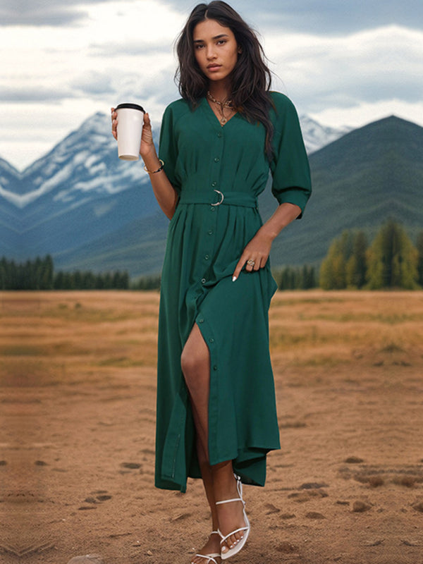 Woman in green V-neck mid-sleeve dress with belt outdoors
