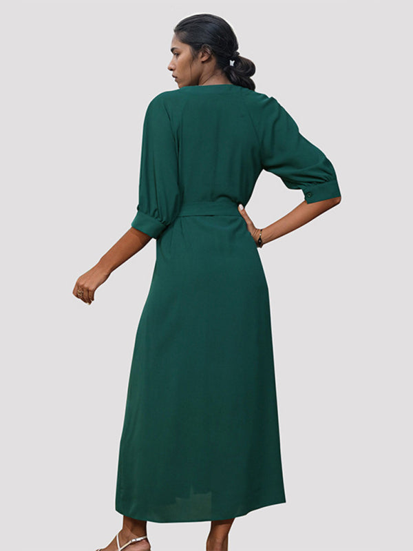 Back view of woman in green V-neck mid-sleeve dress