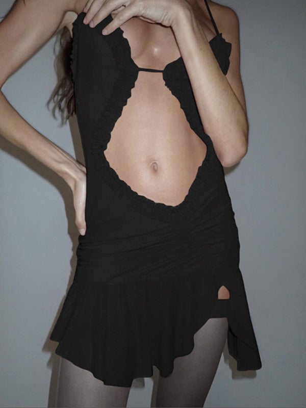 Model in black backless dress