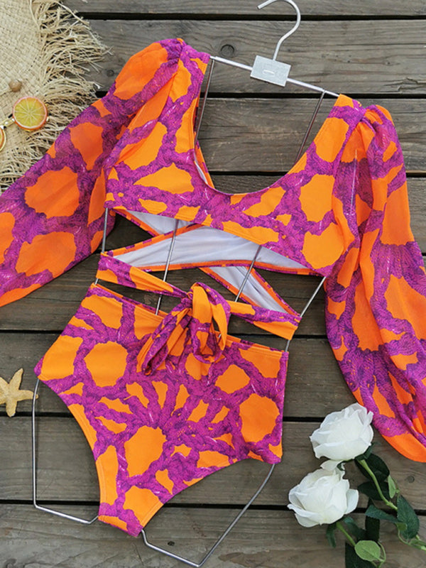 Vibrant printed bikini set with long-sleeved top on hanger