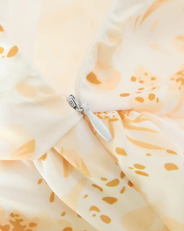 Side zipper detail on floral pleated dress