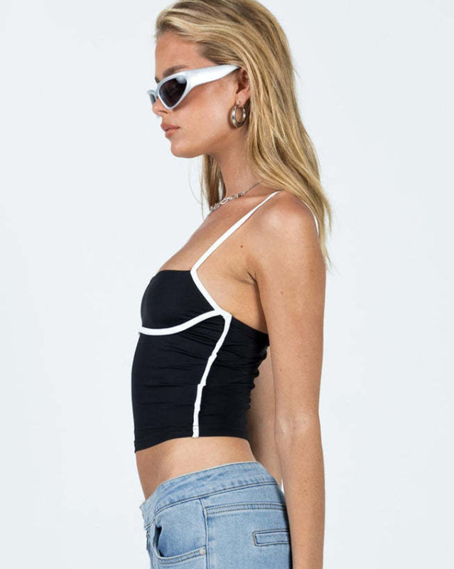Side view of black camisole with white trim