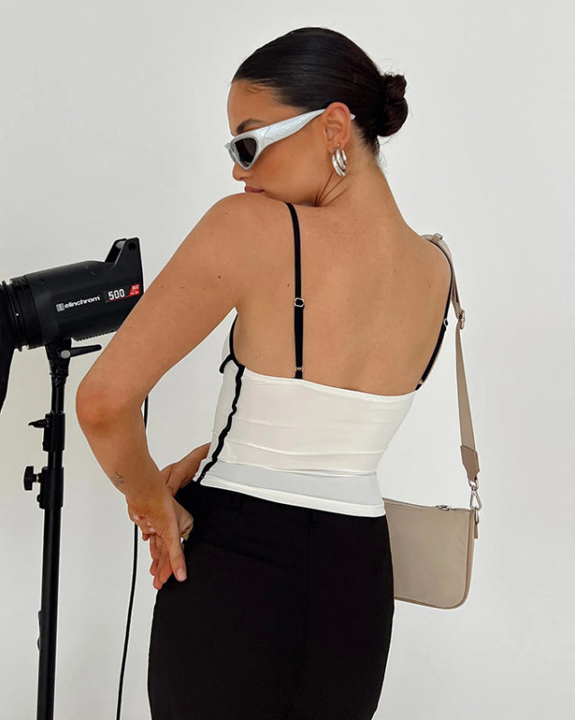 Back view of white camisole with black trim