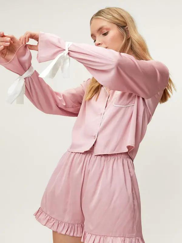 Side view of pink lapel pajama set with ribbon ties