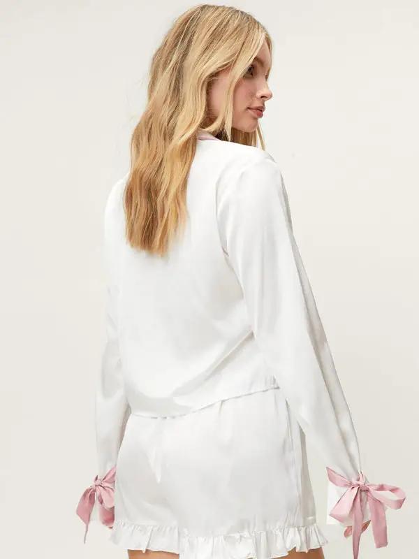White lapel pajama set with pink ribbon details