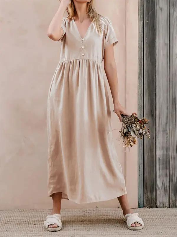 Elegant loose dress with buttons, holding flowers