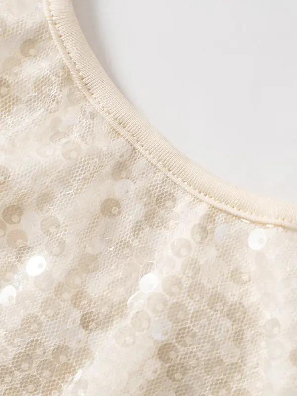 Close-up of sequined fabric on halterneck top