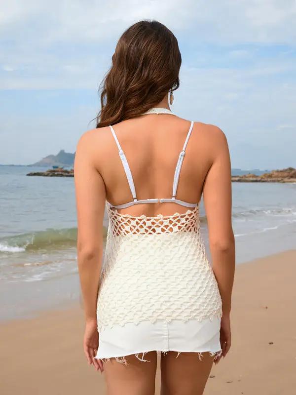 Back view of beige knitted blouse on beach