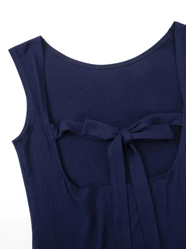 Close-up of navy backless top with bow detail.