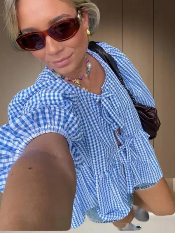 Blue gingham puff sleeve shirt with sunglasses and necklace