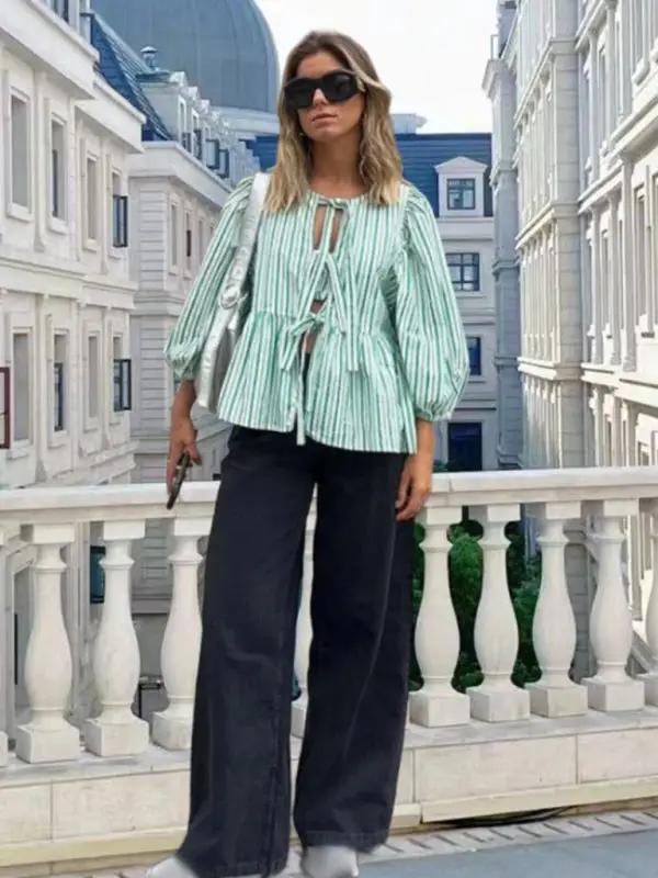 Green striped puff sleeve shirt with black wide-leg pants