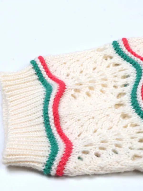 Sleeve detail of crocheted sweater with stripes