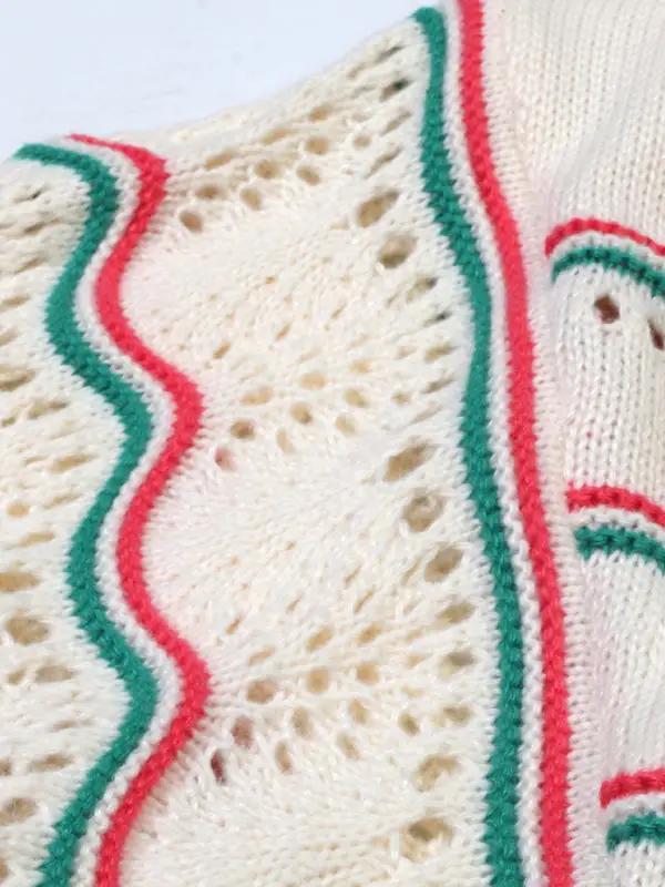 Pattern detail on crocheted sweater with stripes