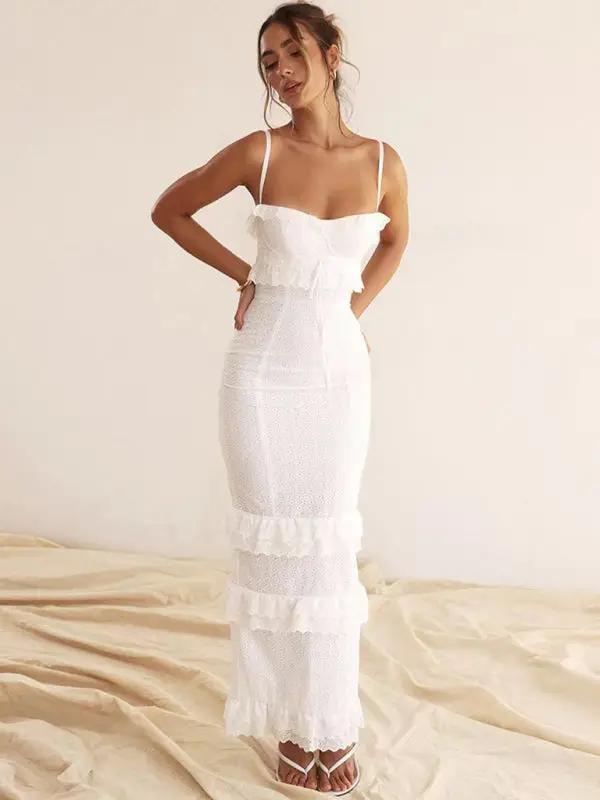 White slim French dress with ruffle details, indoor setting