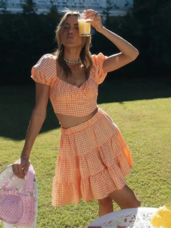 Orange plaid backless tie top and skirt with drink