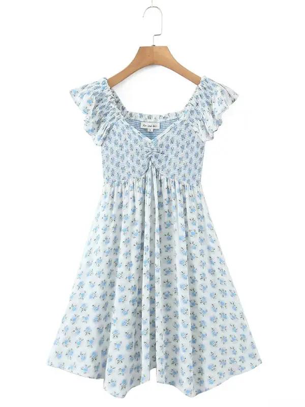Front view of blue floral dress with elastic pleated V-neck