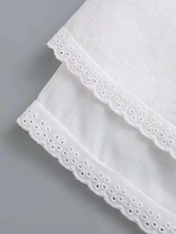 Lace hem detail on white A-line short dress