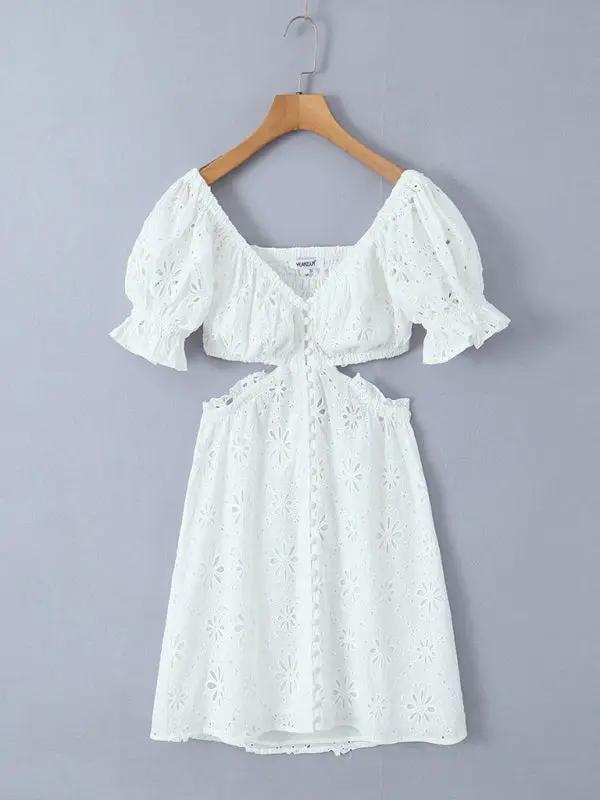 Full view of white lace one-shoulder dress on hanger
