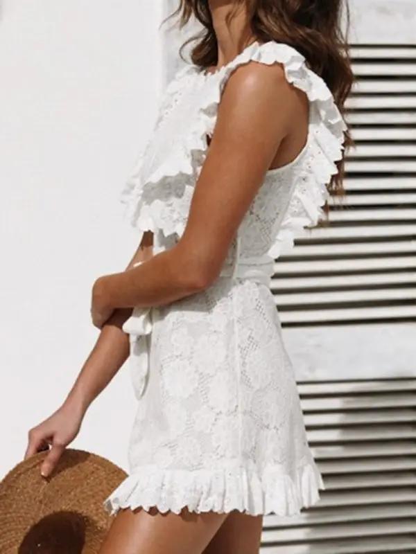 Side view of white lace dress with ruffled edges