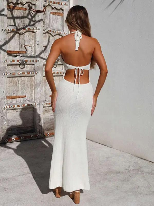 Back view of white backless halterneck knitted dress