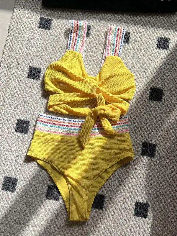 Pink high waisted two-piece swimsuit with rainbow straps
