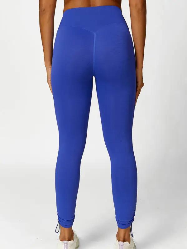 Blue drawstring yoga leggings, back view