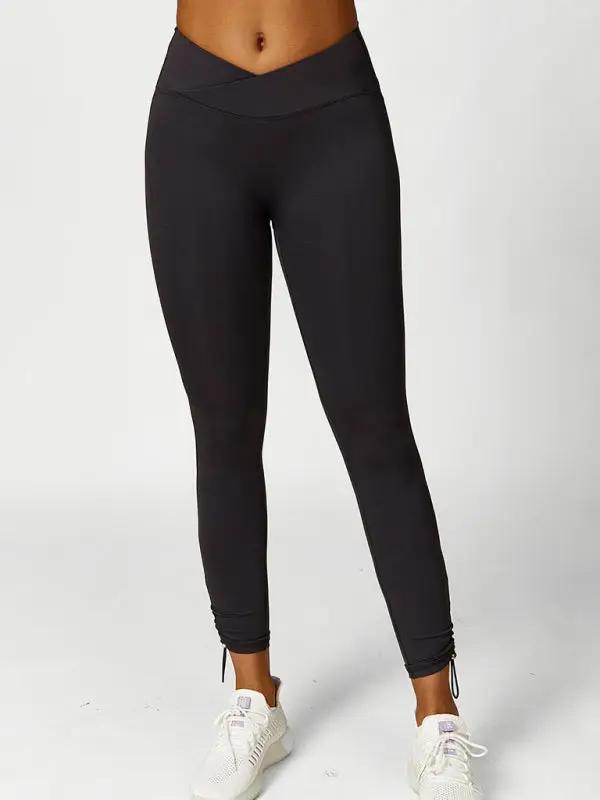 Black drawstring yoga leggings, front view