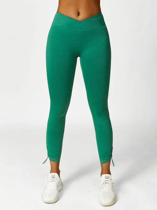Green drawstring yoga leggings, front view